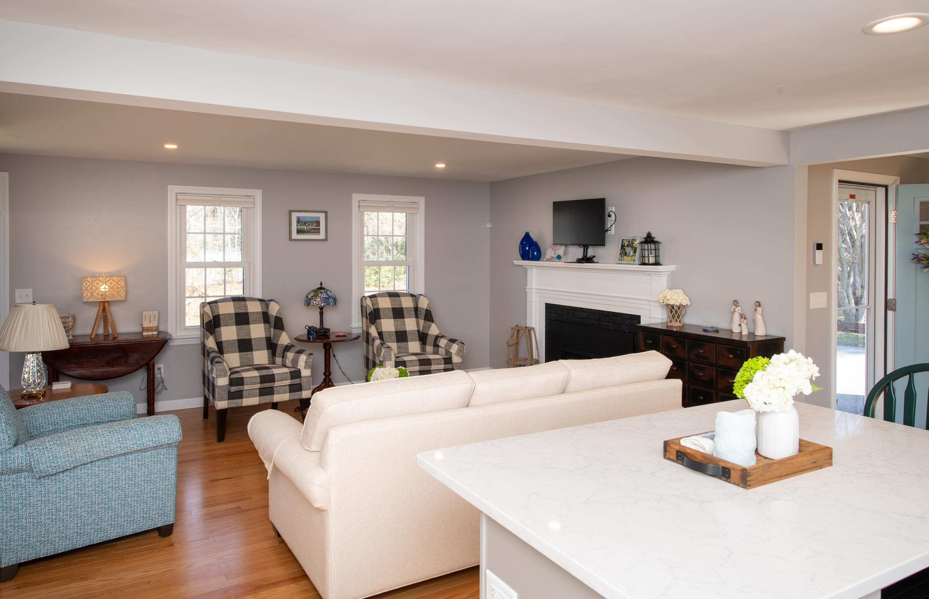 89 Trout Brook Road Cotuit, MA 02635 - Photo 12 of 67 a living room with furniture and a wooden floor