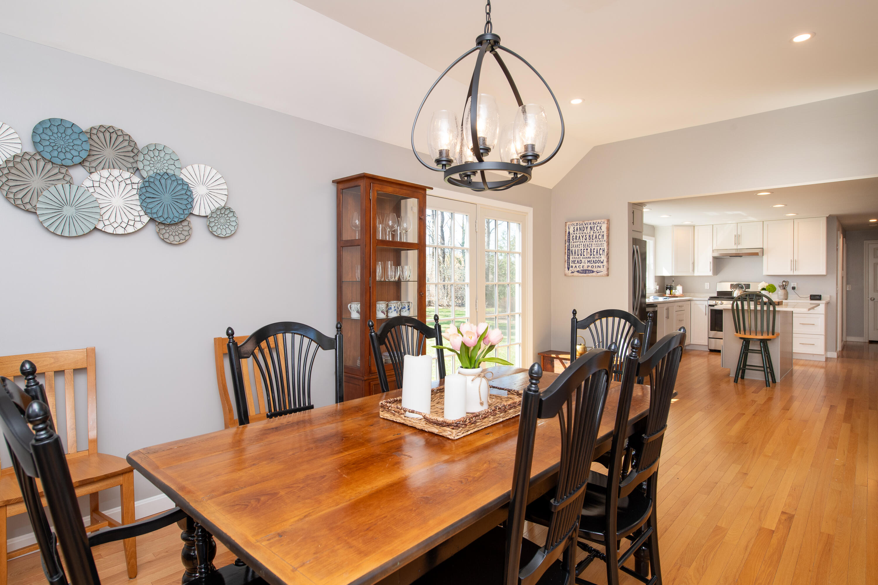 89 Trout Brook Road Cotuit, MA 02635 - Photo 14 of 67 a view of a dining room with furniture wooden floor and chandelier