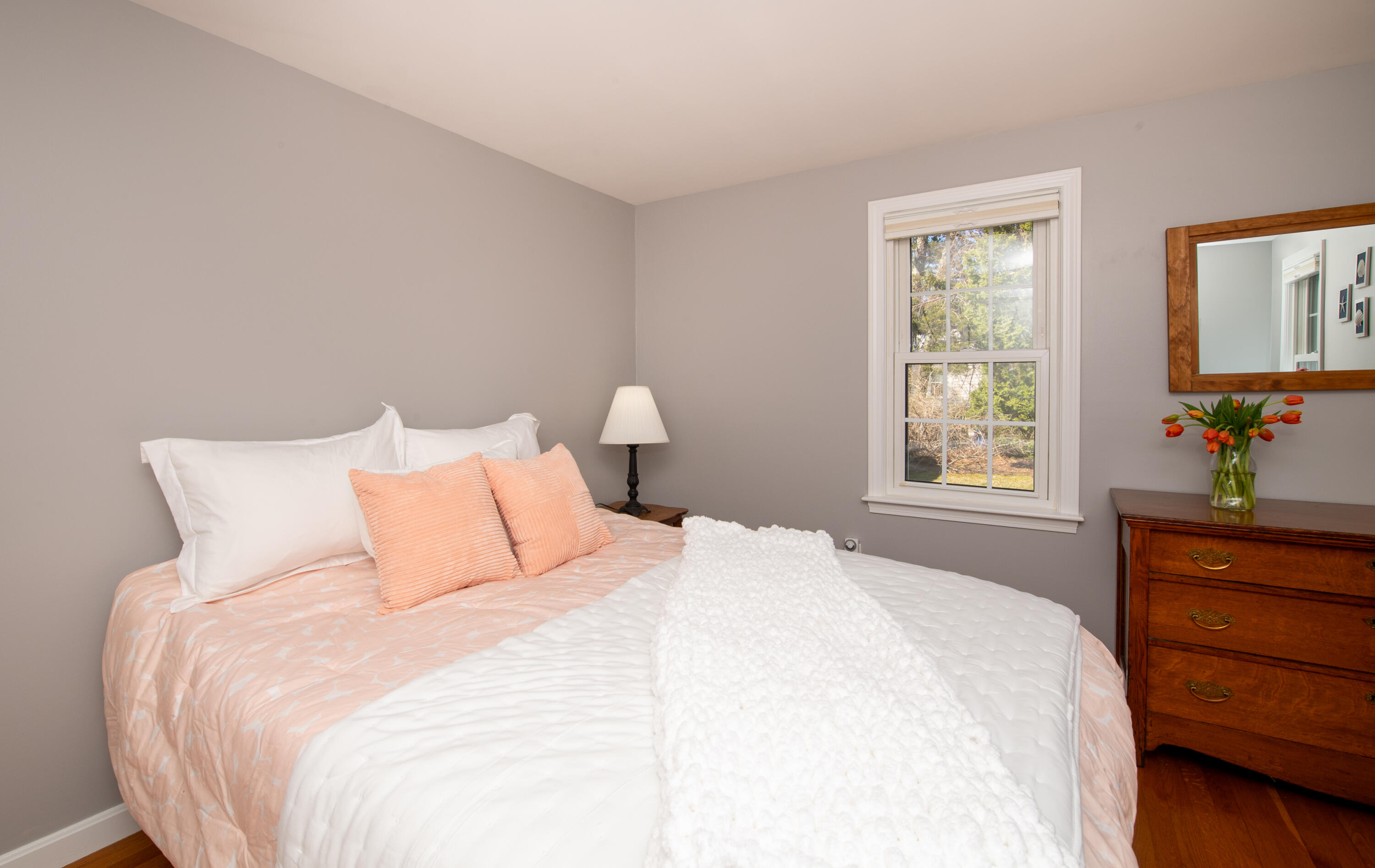 89 Trout Brook Road Cotuit, MA 02635 - Photo 19 of 67 a bedroom with a bed and a window