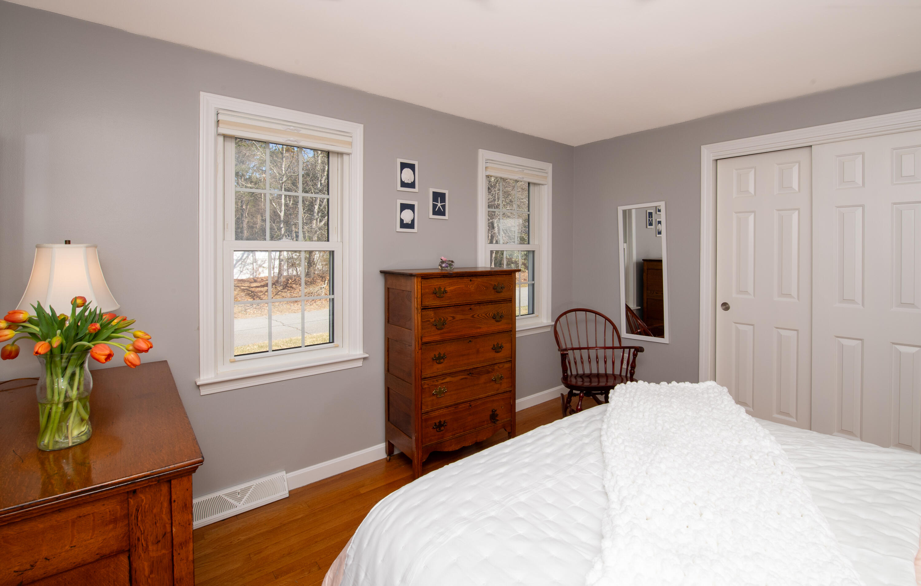 89 Trout Brook Road Cotuit, MA 02635 - Photo 20 of 67 a bedroom with a bed dresser and a window