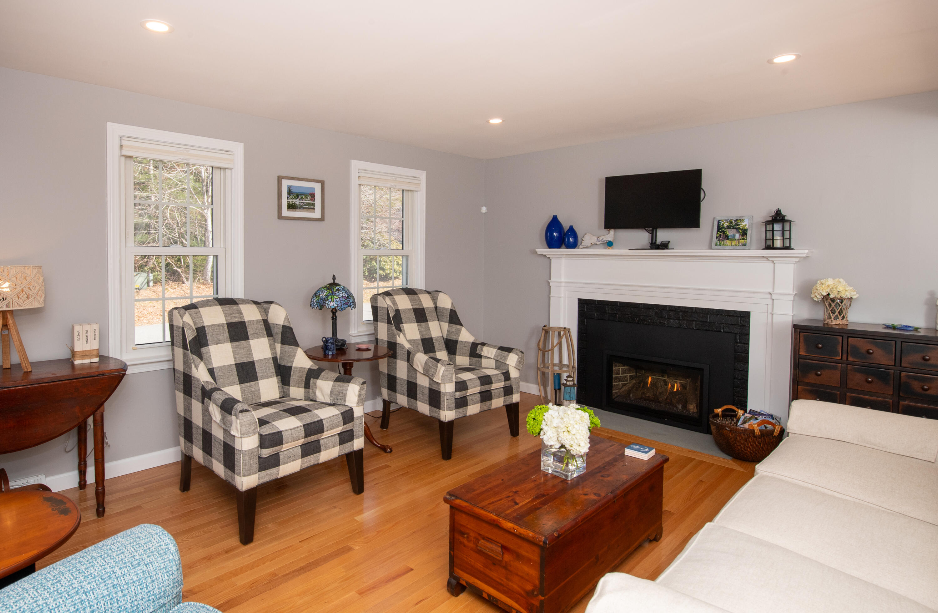 89 Trout Brook Road Cotuit, MA 02635 - Photo 3 of 67 a living room with furniture and a fireplace