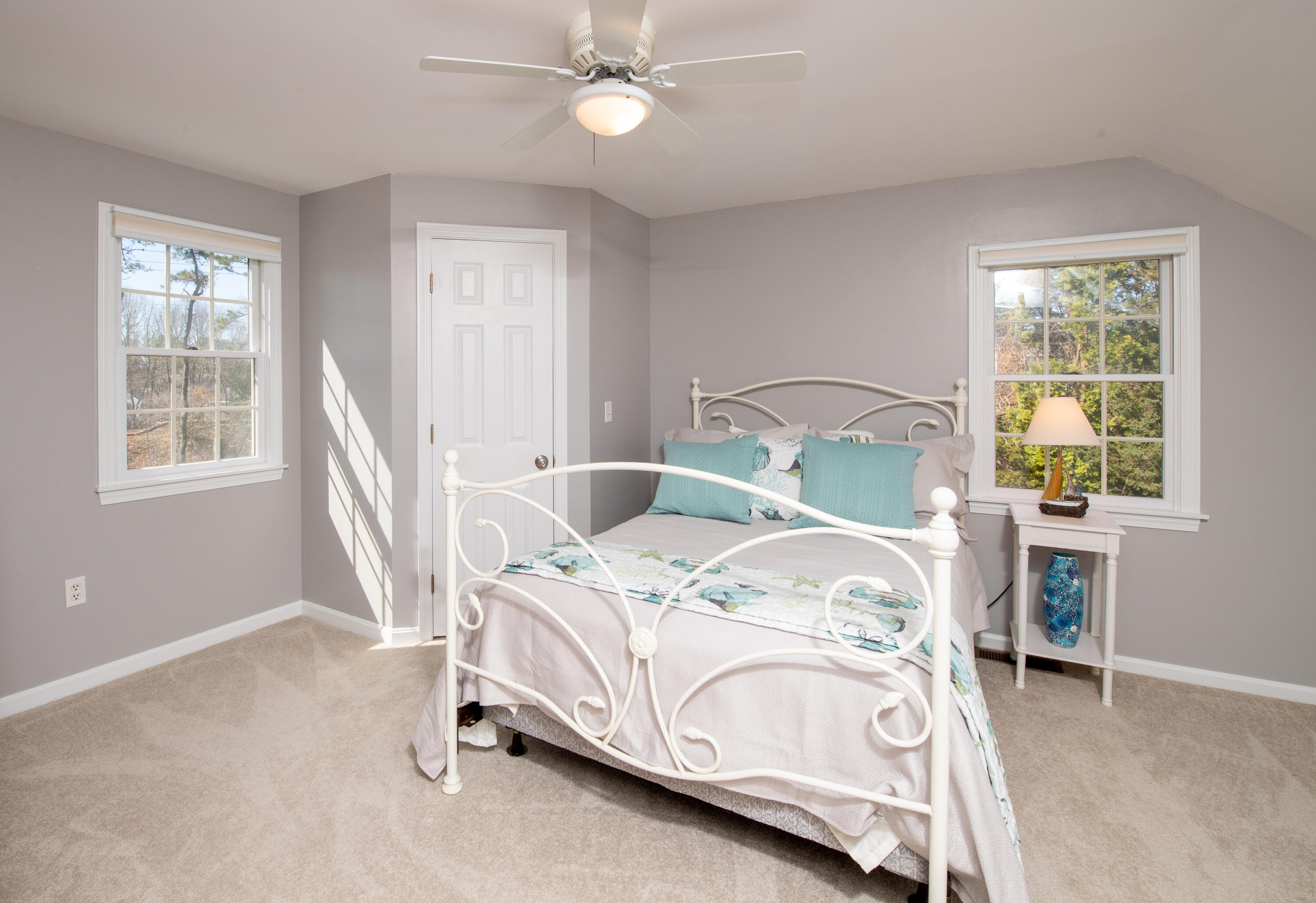 89 Trout Brook Road Cotuit, MA 02635 - Photo 33 of 67 a bedroom with a bed next to a window