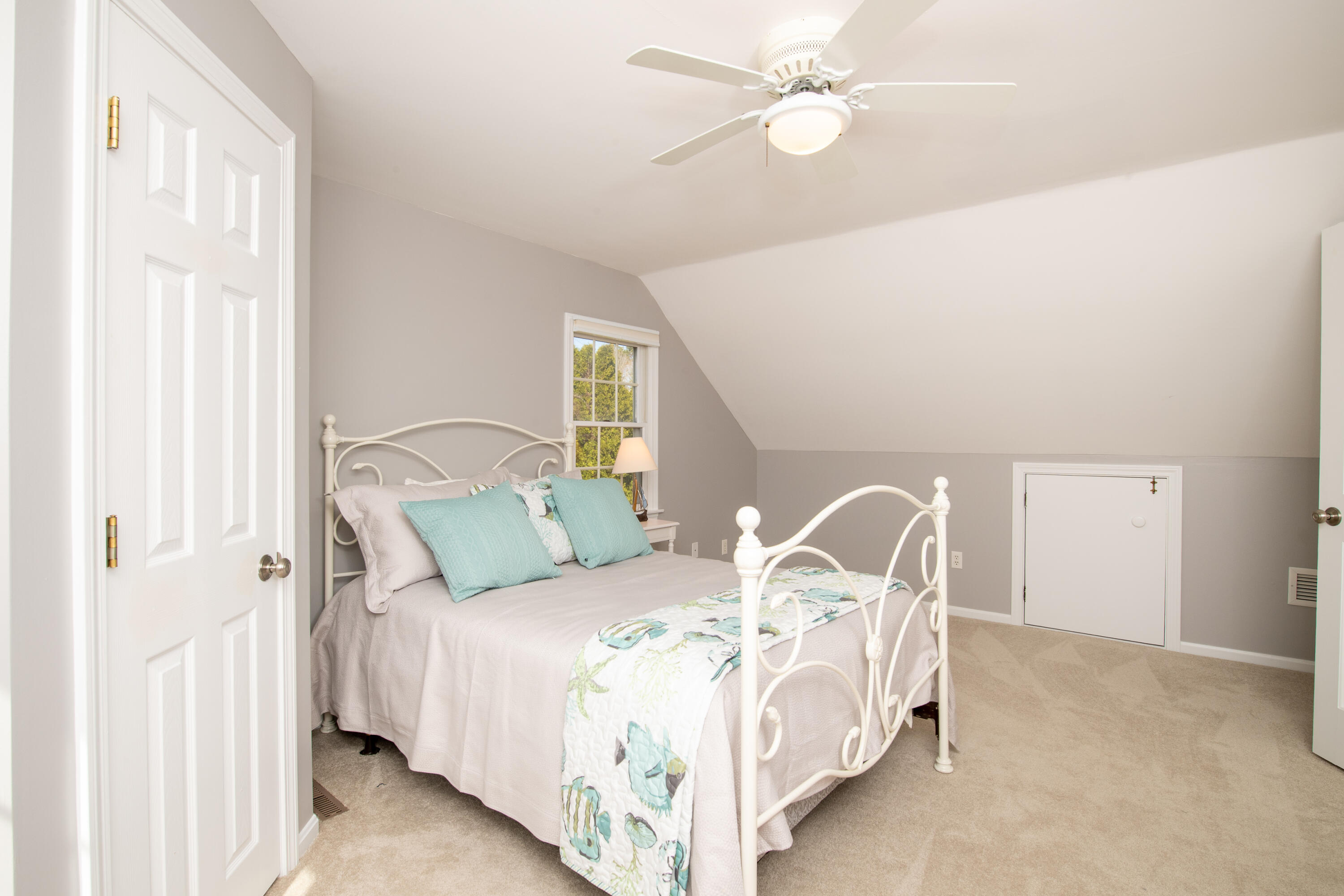 89 Trout Brook Road Cotuit, MA 02635 - Photo 40 of 67 a large bed sitting in a bedroom next to a window