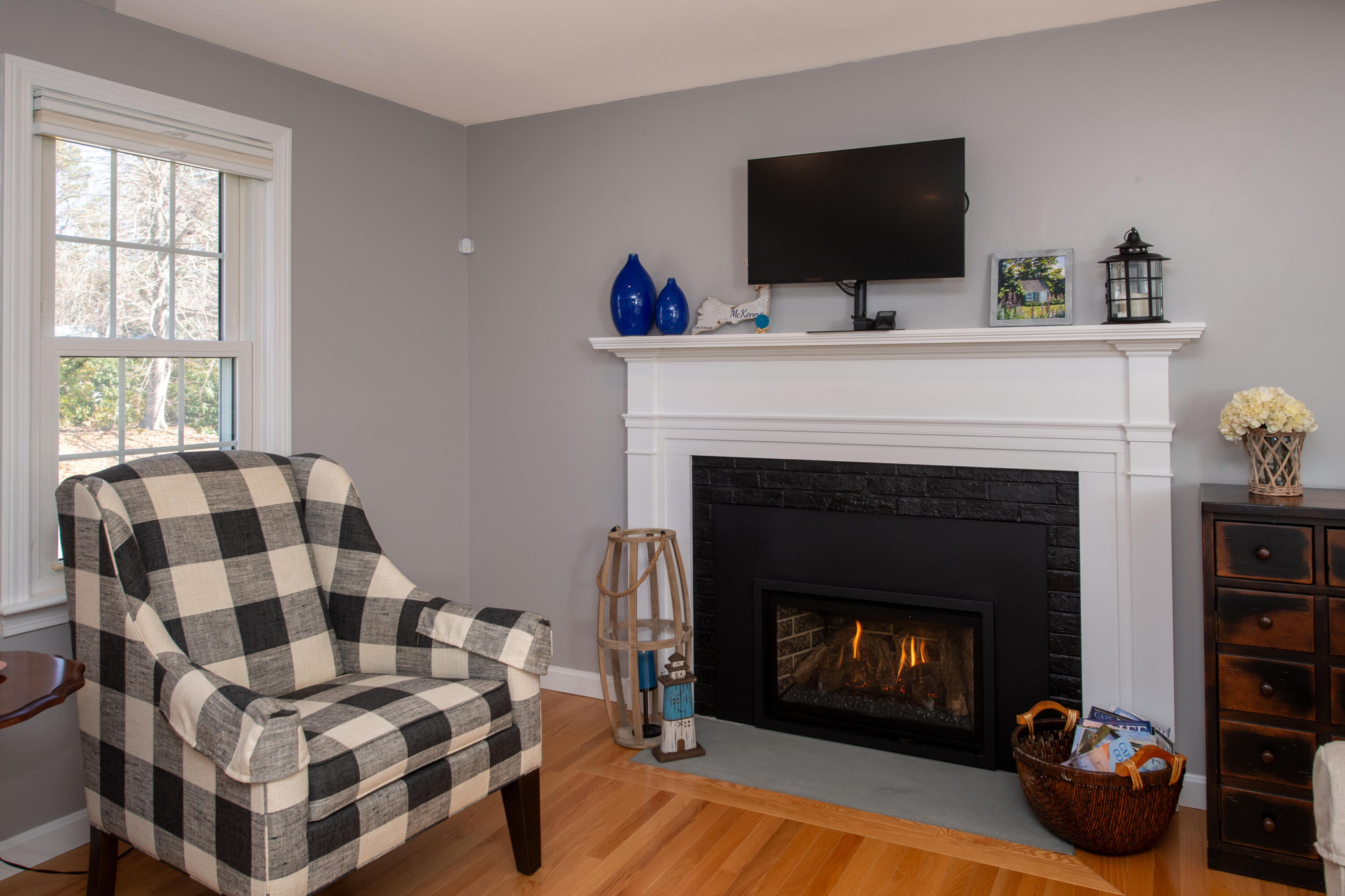 89 Trout Brook Road Cotuit, MA 02635 - Photo 4 of 67 a living room with furniture and a fireplace