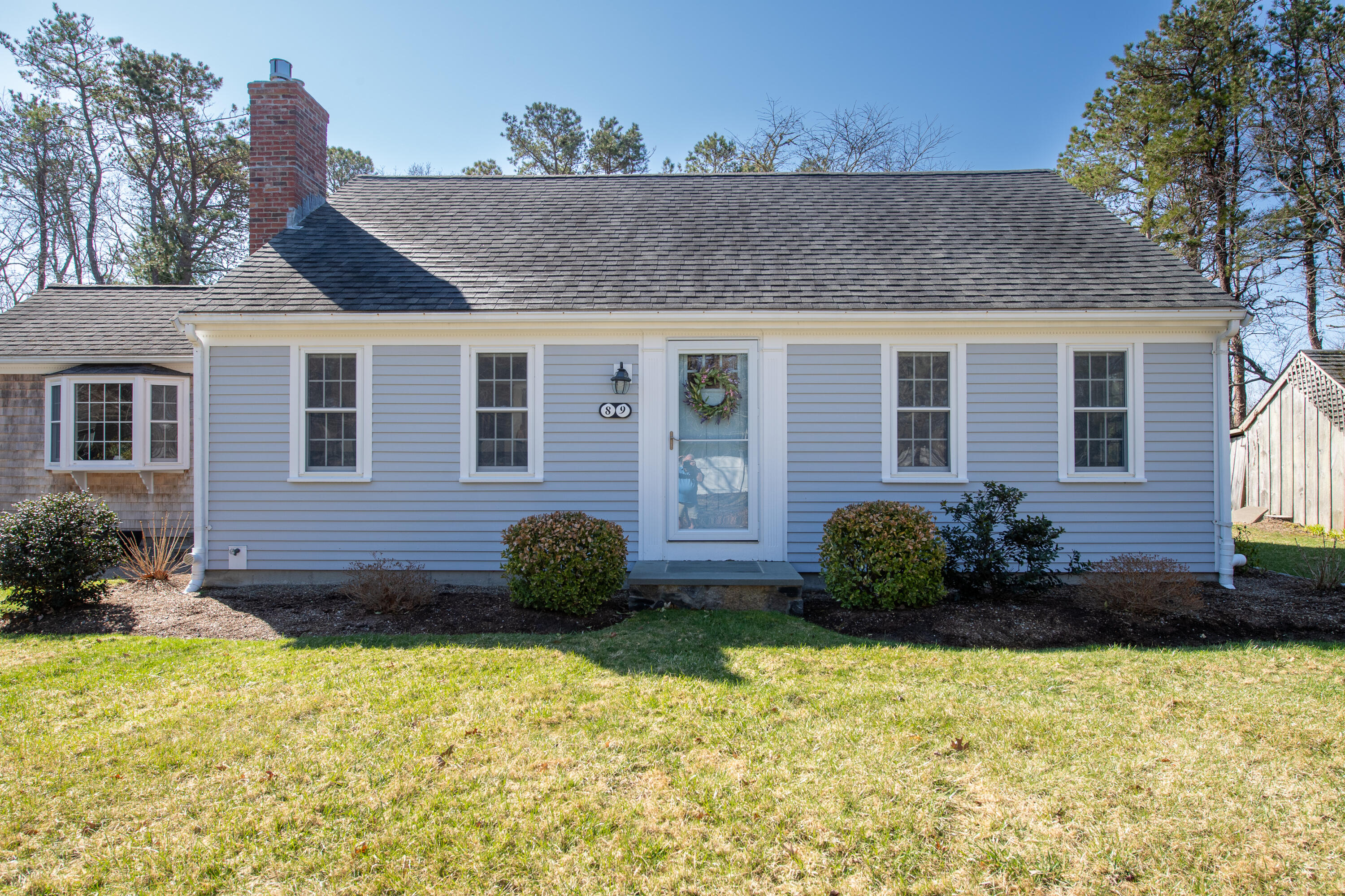 89 Trout Brook Road Cotuit, MA 02635 - Photo 47 of 67 a view of a house with a yard