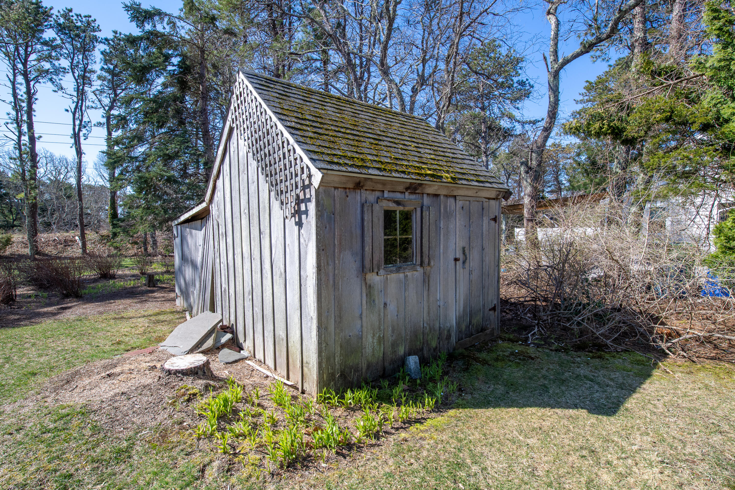 89 Trout Brook Road Cotuit, MA 02635 - Photo 49 of 67 a view of a house with backyard and sitting area