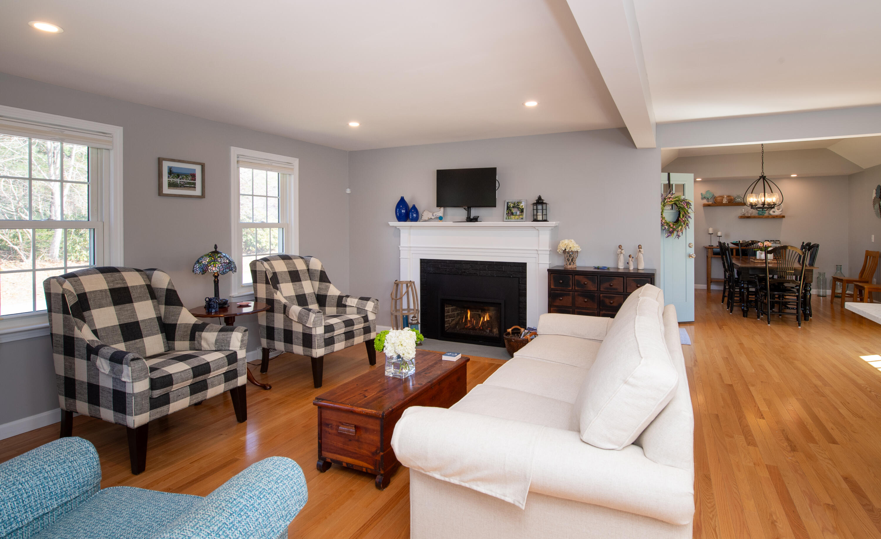 89 Trout Brook Road Cotuit, MA 02635 - Photo 5 of 67 a living room with furniture fireplace and window
