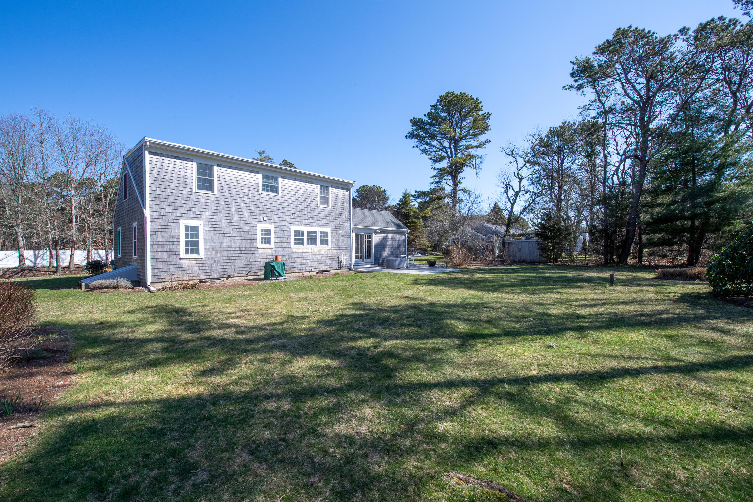 89 Trout Brook Road Cotuit, MA 02635 - Photo 51 of 67 a view of a big house with a big yard