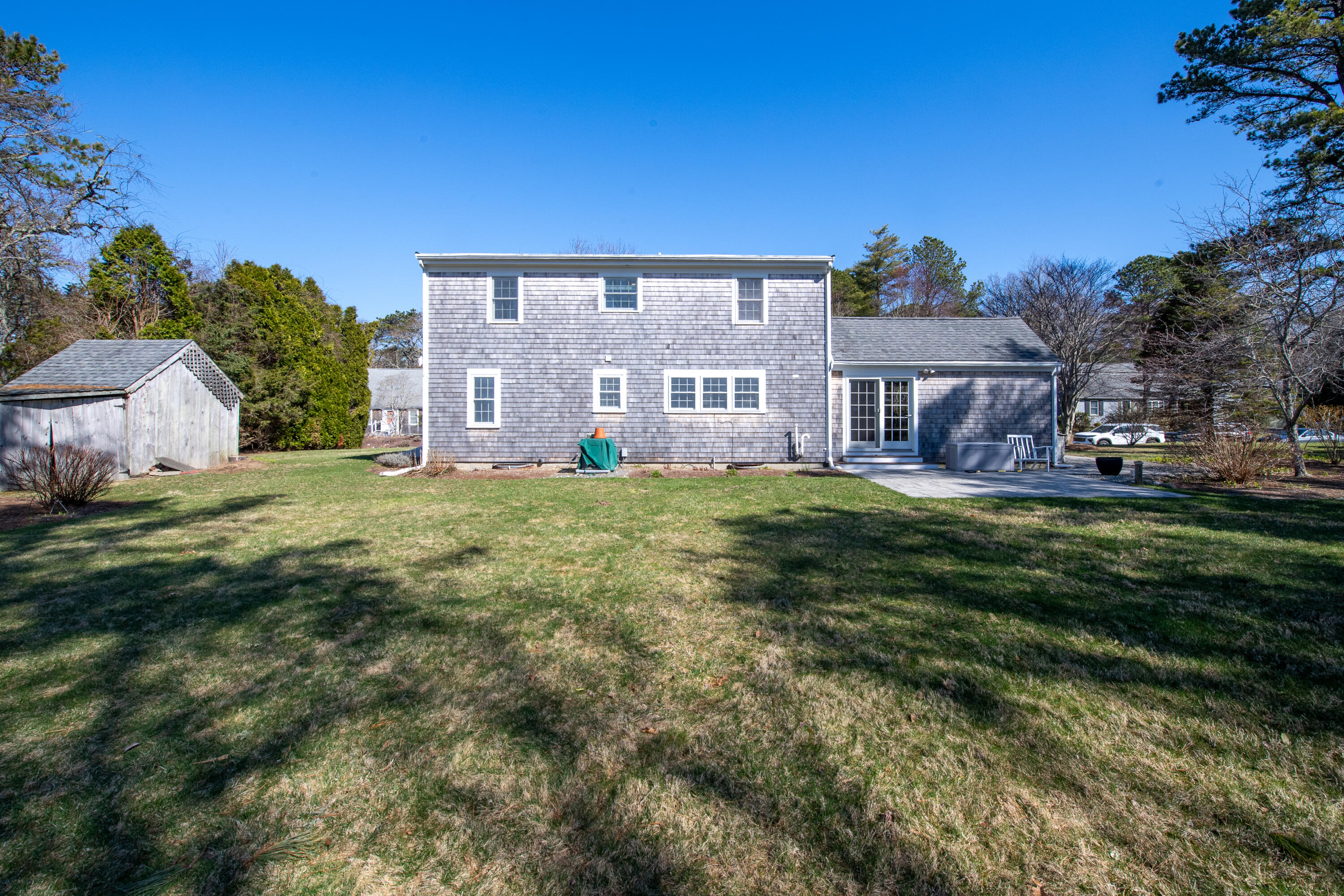 89 Trout Brook Road Cotuit, MA 02635 - Photo 52 of 67 a view of a house with a big yard