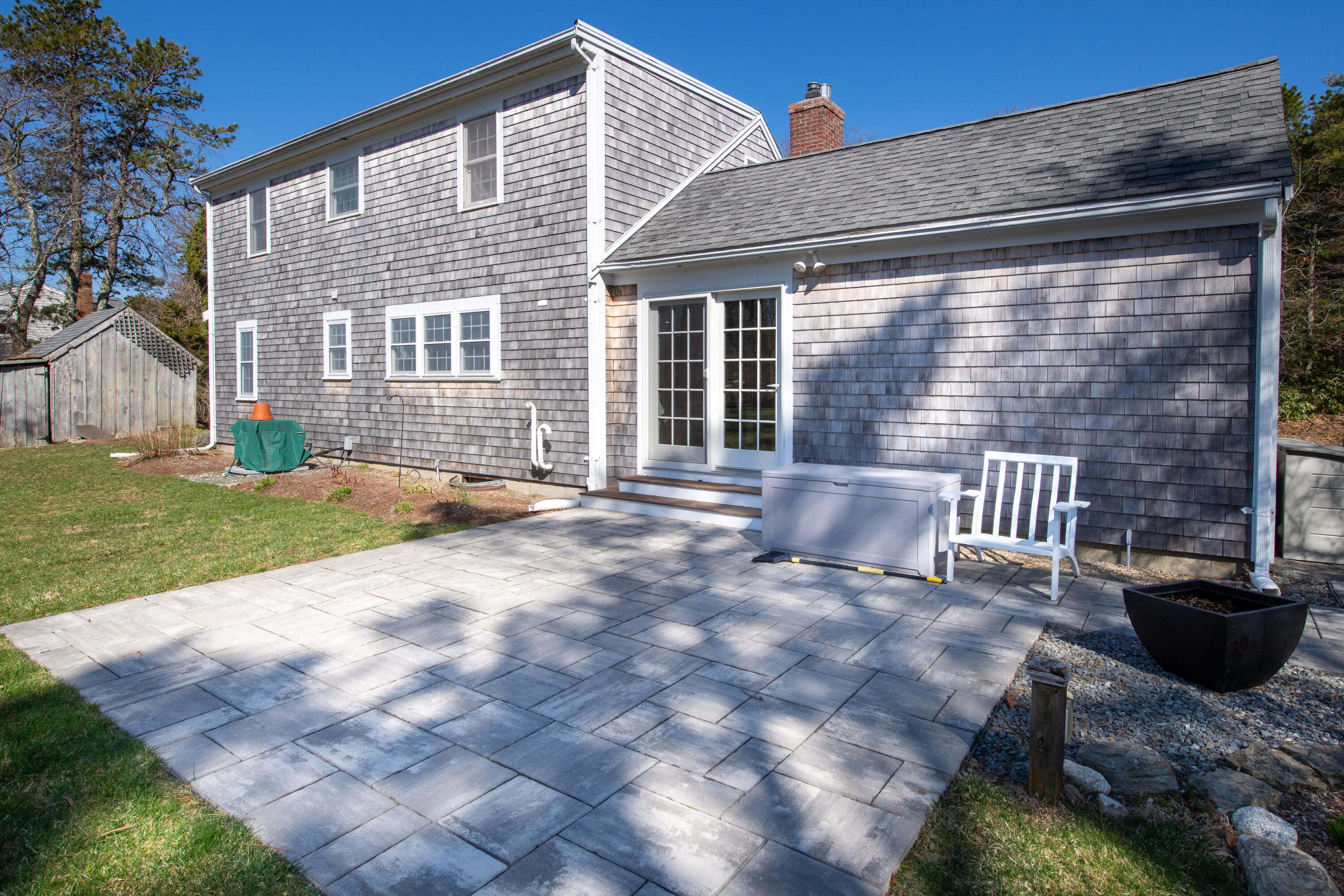 89 Trout Brook Road Cotuit, MA 02635 - Photo 53 of 67 a view of a house with backyard and sitting area