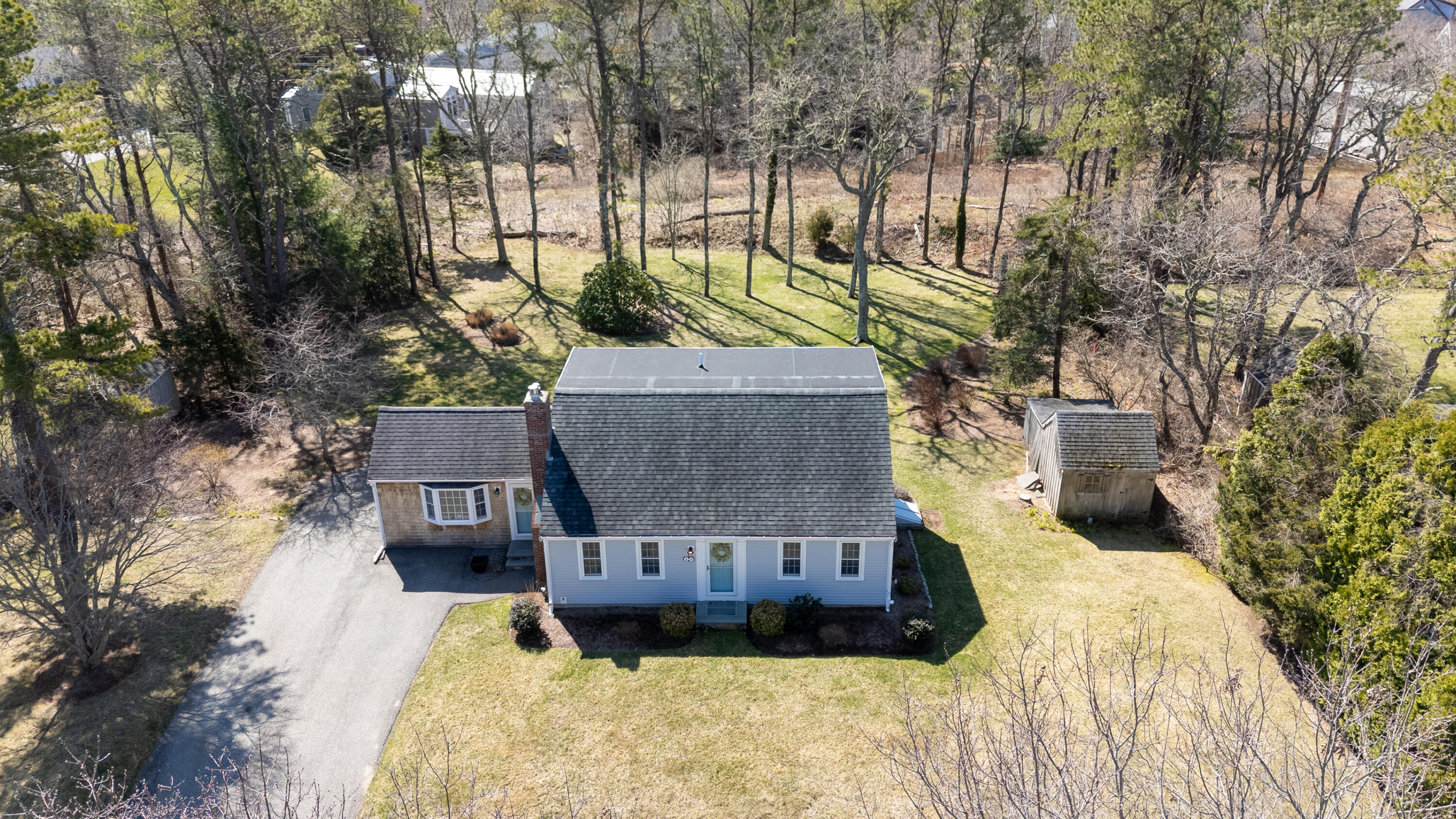 89 Trout Brook Road Cotuit, MA 02635 - Photo 58 of 67 a view of a back yard of the house