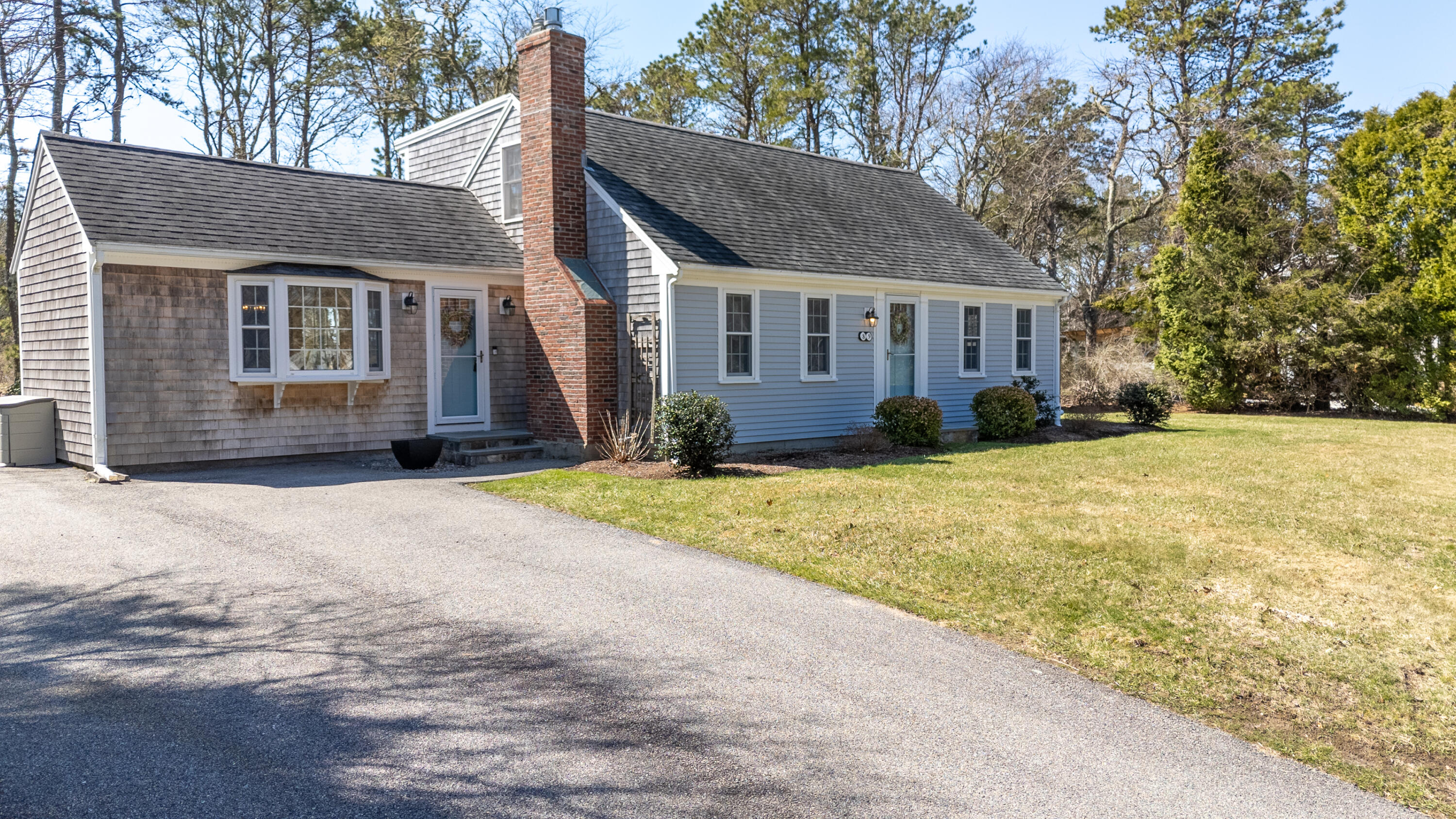 89 Trout Brook Road Cotuit, MA 02635 - Photo 67 of 67 front view of a house with a yard