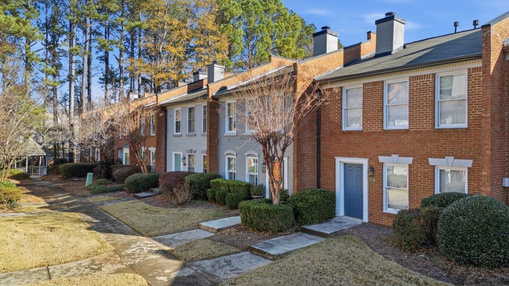 4138 Crape Myrtle Lane Duluth, GA 30096 - Photo 13 of 50 a front view of a house with garden