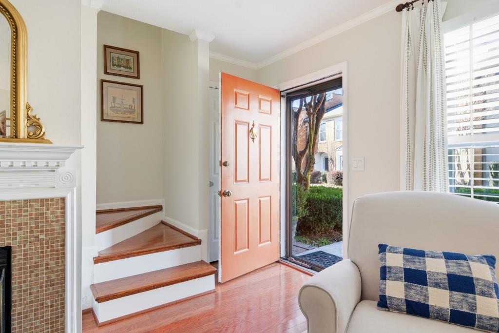 4138 Crape Myrtle Lane Duluth, GA 30096 - Photo 16 of 50 a living room with furniture and a floor to ceiling window