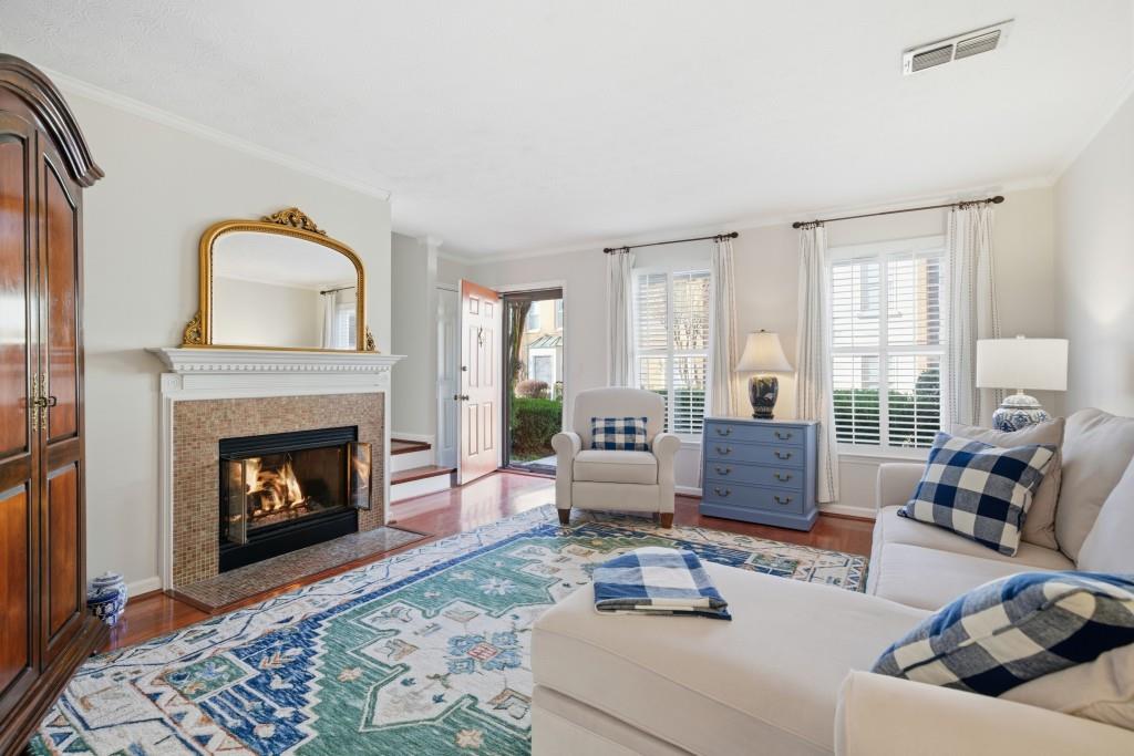 4138 Crape Myrtle Lane Duluth, GA 30096 - Photo 18 of 50 a living room with furniture and a fireplace