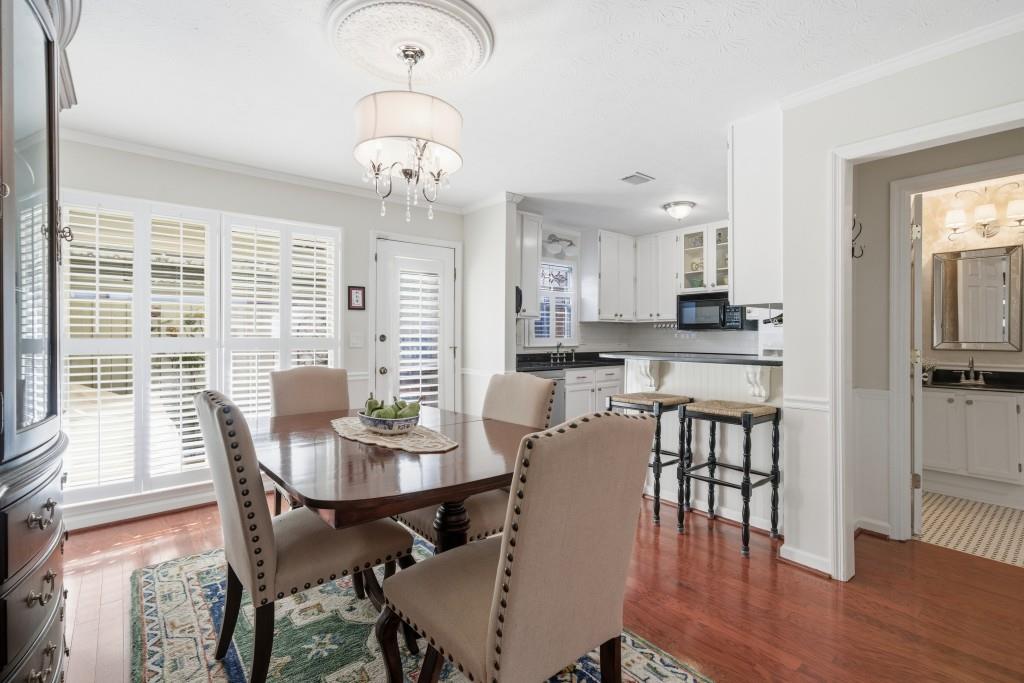 4138 Crape Myrtle Lane Duluth, GA 30096 - Photo 20 of 50 a view of a dining room with furniture window and wooden floor