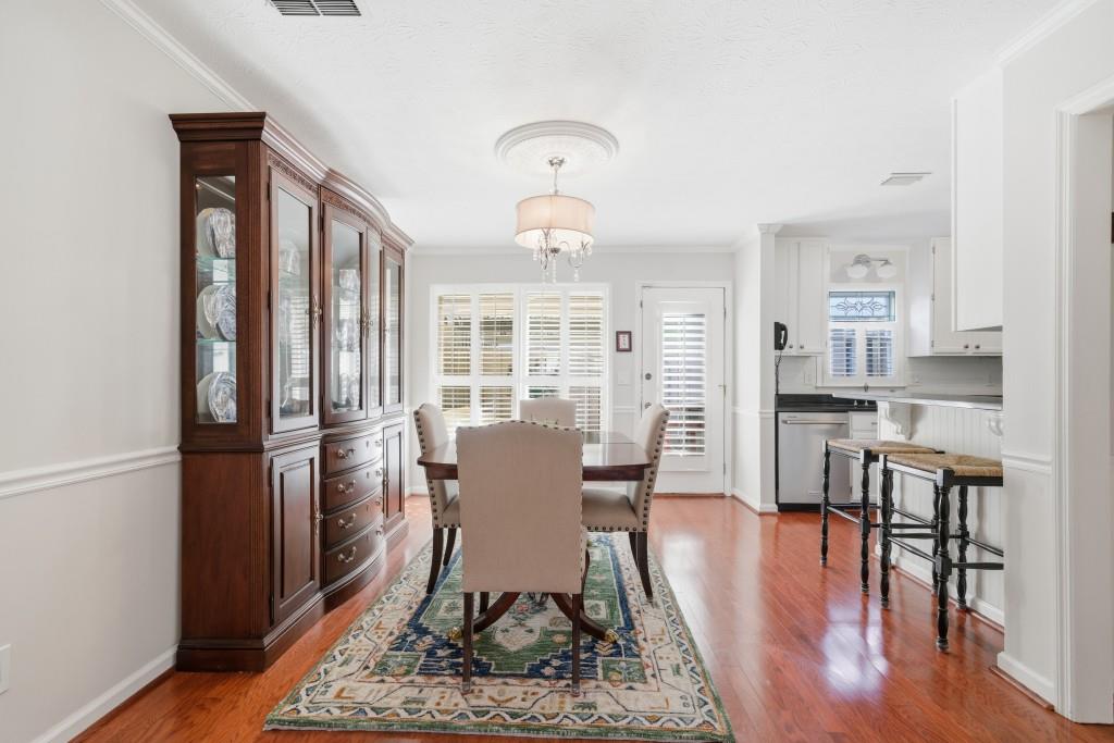 4138 Crape Myrtle Lane Duluth, GA 30096 - Photo 21 of 50 a view of a dining room with furniture window and wooden floor