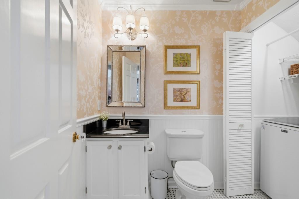 4138 Crape Myrtle Lane Duluth, GA 30096 - Photo 26 of 50 a bathroom with a toilet a sink and mirror