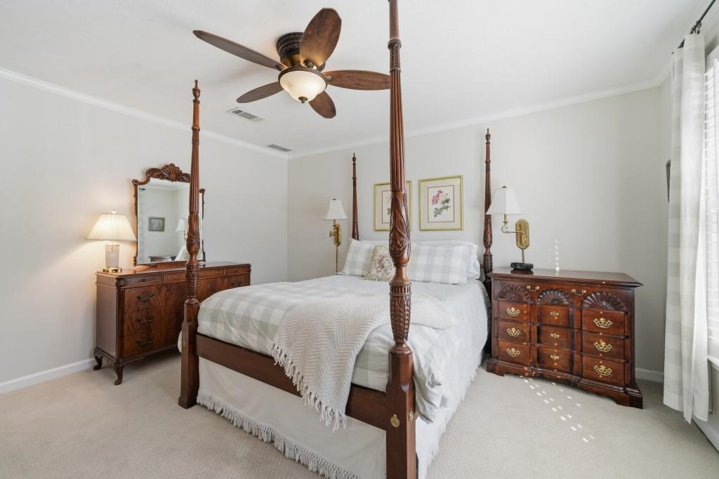 4138 Crape Myrtle Lane Duluth, GA 30096 - Photo 28 of 50 a bedroom with a bed chandelier and dresser
