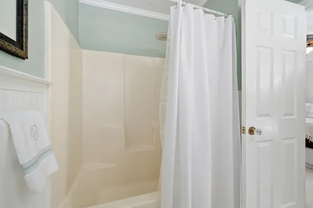 a bathroom with a shower and a tub