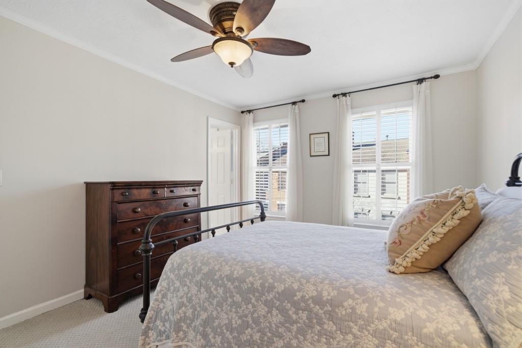 4138 Crape Myrtle Lane Duluth, GA 30096 - Photo 30 of 50 a bedroom with a bed dresser and a window