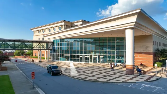 an aerial view of a house with a garden and lake view