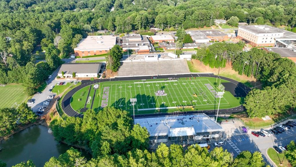 4138 Crape Myrtle Lane Duluth, GA 30096 - Photo 44 of 50 an aerial view of a house with a garden and lake view