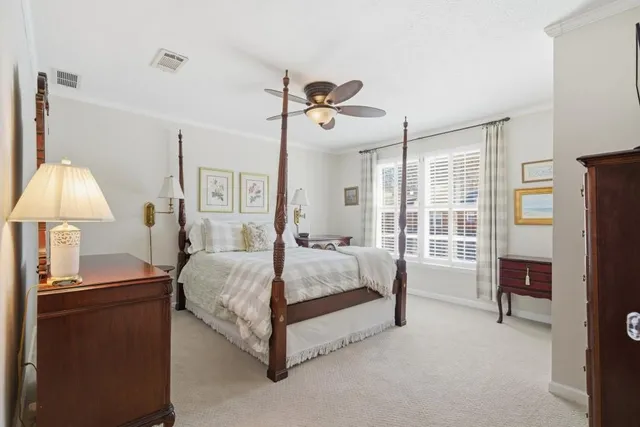 a bed room with a bed and a table