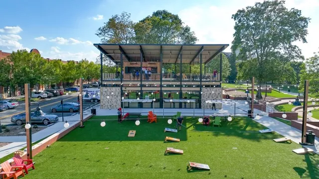 a view of a play ground in front of a house