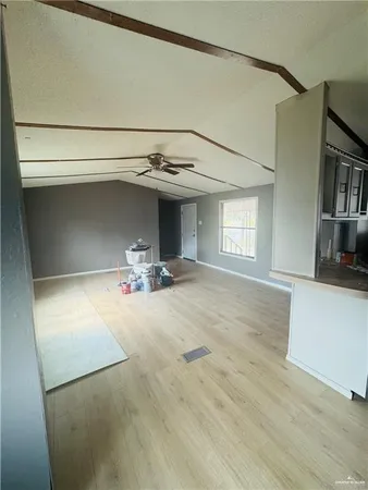 a view of a livingroom with a furniture and staircase