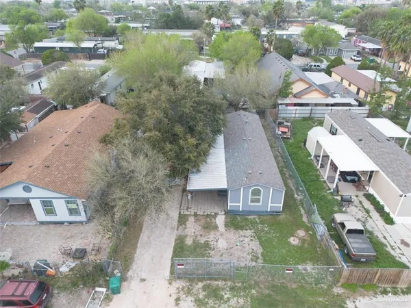 an aerial view of a house with a lake view
