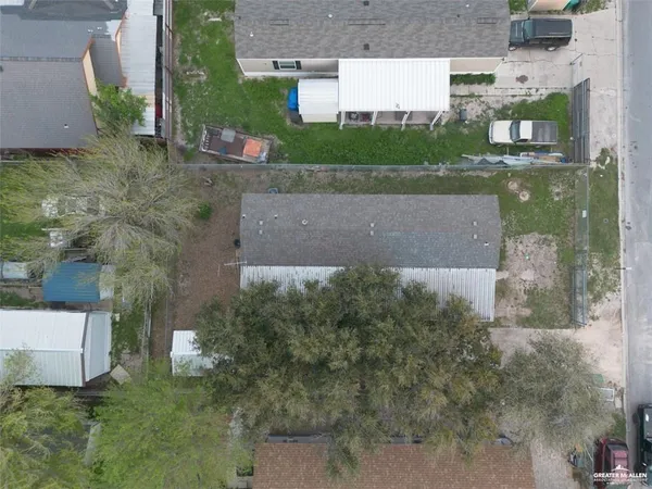 a aerial view of a house with a yard