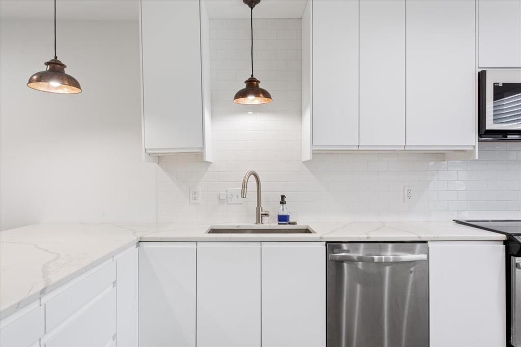 1326 South 12th Street Waco, TX 76706 - Photo 11 of 25 a kitchen with a sink and cabinets
