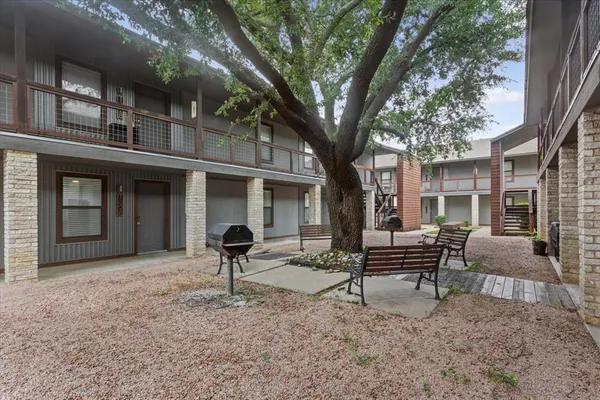 a front view of a house with outdoor seating