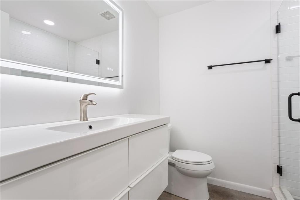1326 South 12th Street Waco, TX 76706 - Photo 23 of 25 a bathroom with a sink a toilet and a shower