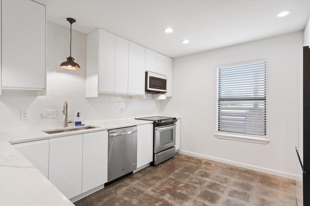 1326 South 12th Street Waco, TX 76706 - Photo 10 of 25 a kitchen with a sink and cabinets