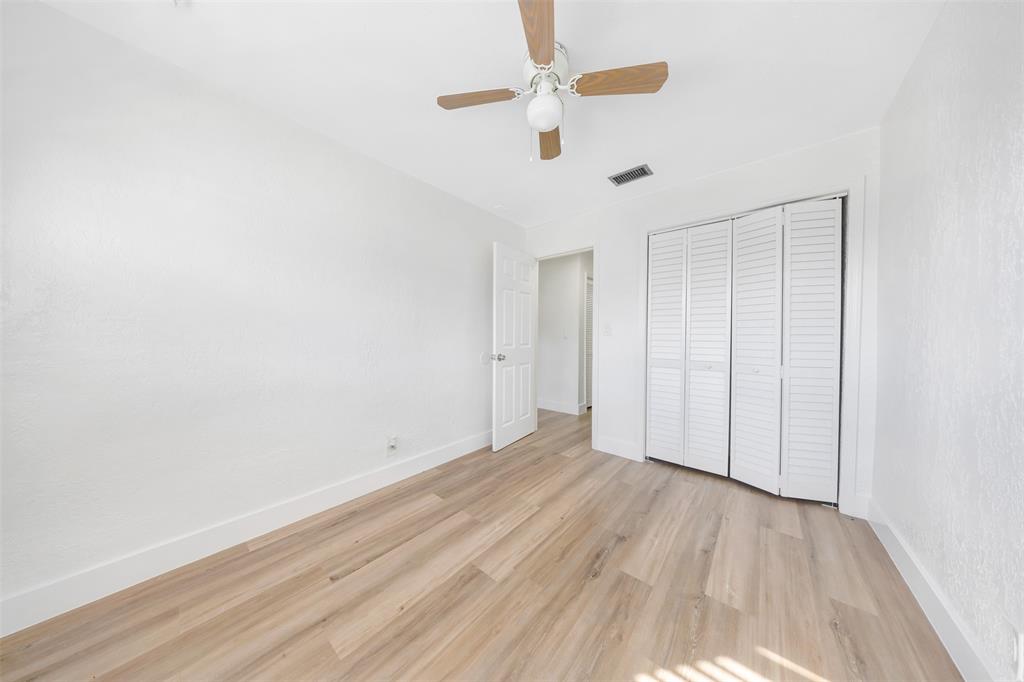 20 Northwest 7th Avenue Pompano Beach, FL 33060 - Photo 13 of 22 a view of an empty room with wooden floor