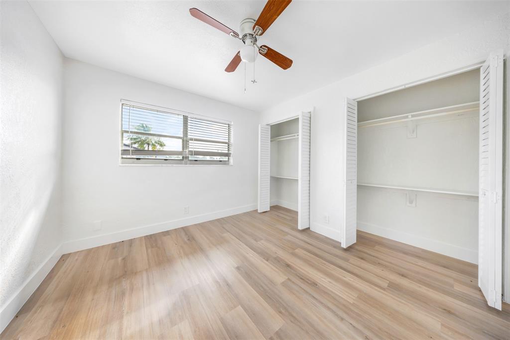 20 Northwest 7th Avenue Pompano Beach, FL 33060 - Photo 14 of 22 wooden floor in an empty room with a window