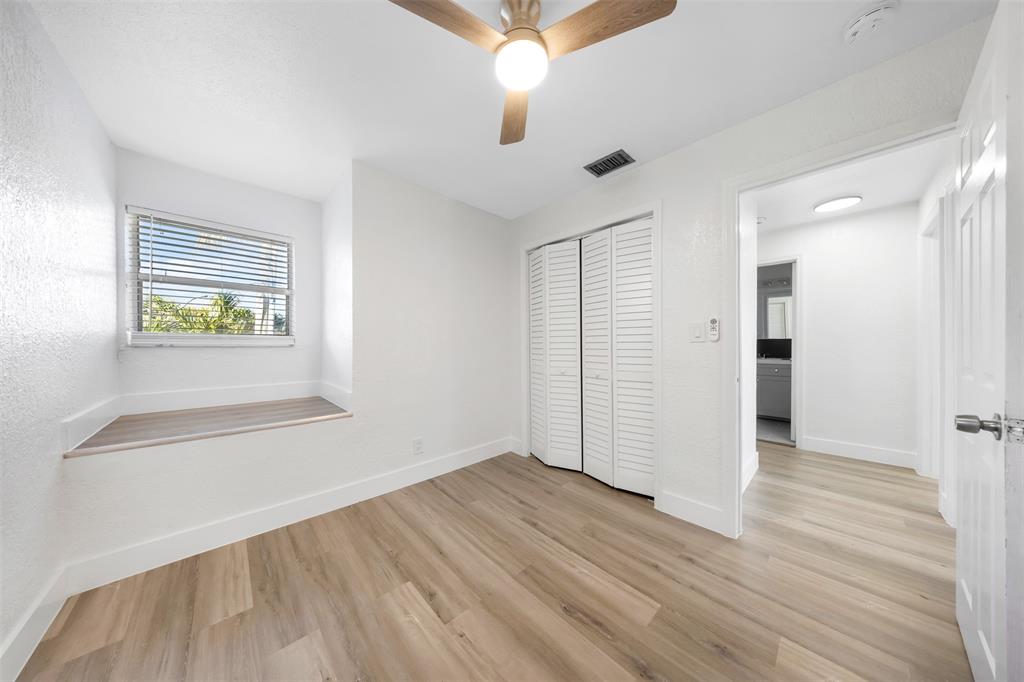 20 Northwest 7th Avenue Pompano Beach, FL 33060 - Photo 17 of 22 wooden floor in an empty room with a window