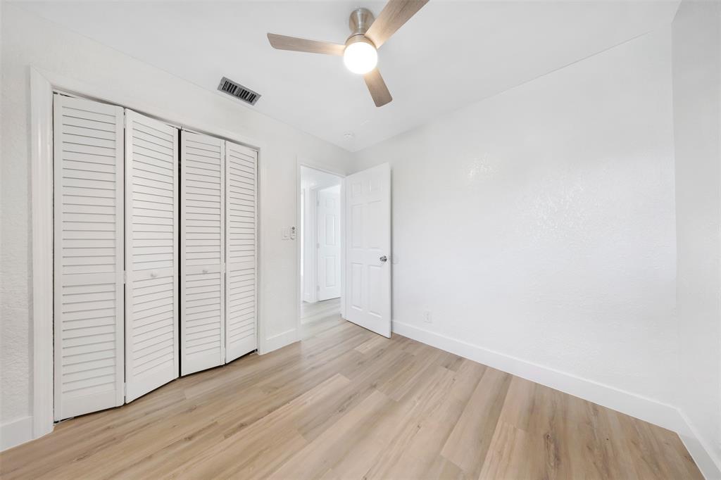 20 Northwest 7th Avenue Pompano Beach, FL 33060 - Photo 18 of 22 wooden floor in an empty room with a window