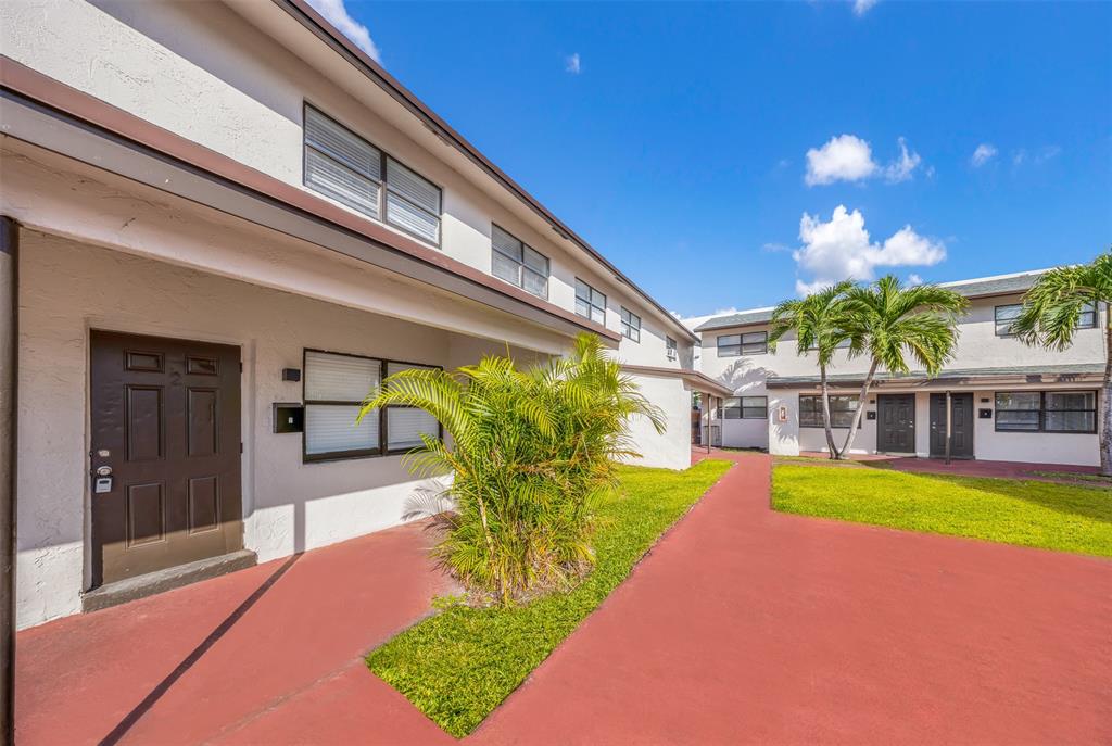 20 Northwest 7th Avenue Pompano Beach, FL 33060 - Photo 19 of 22 a view of a house with a swimming pool