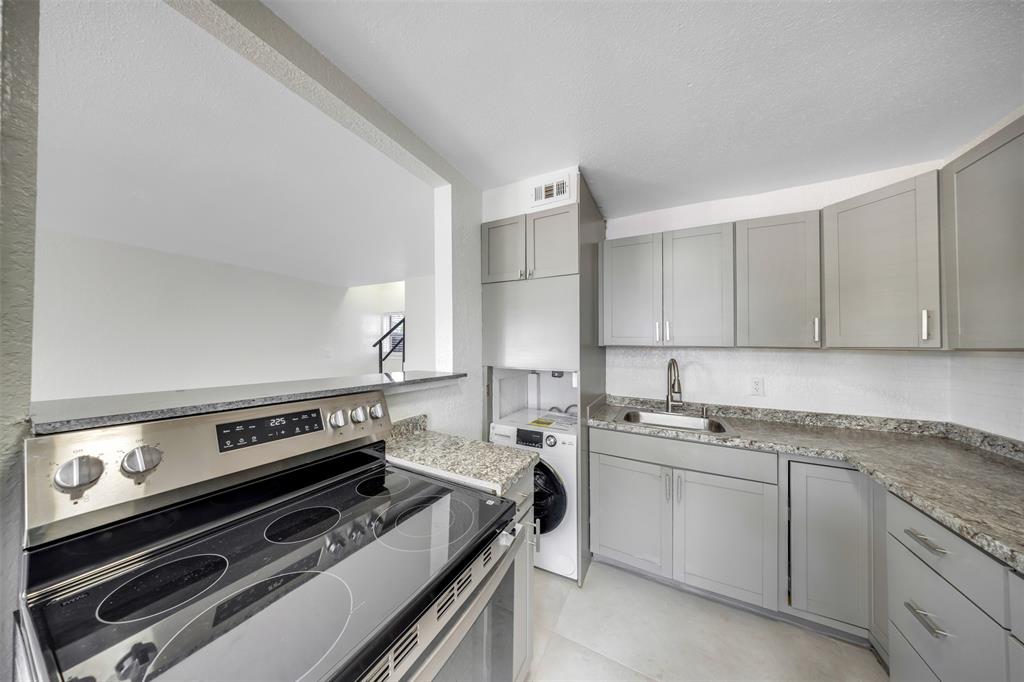 20 Northwest 7th Avenue Pompano Beach, FL 33060 - Photo 2 of 22 a view of a kitchen with a stove top oven