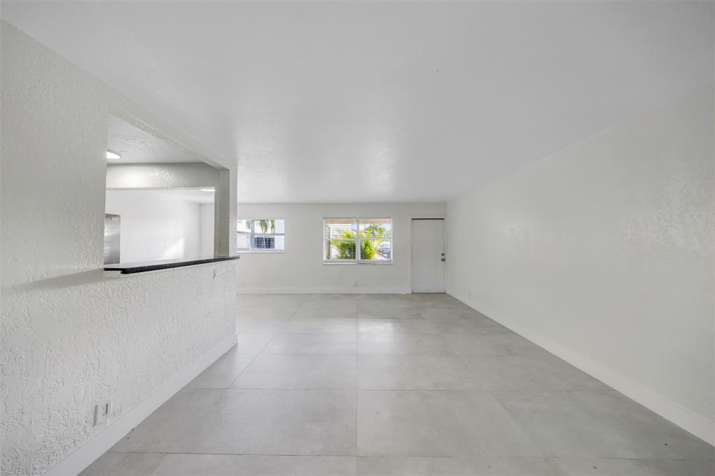 20 Northwest 7th Avenue Pompano Beach, FL 33060 - Photo 8 of 22 an empty room with windows