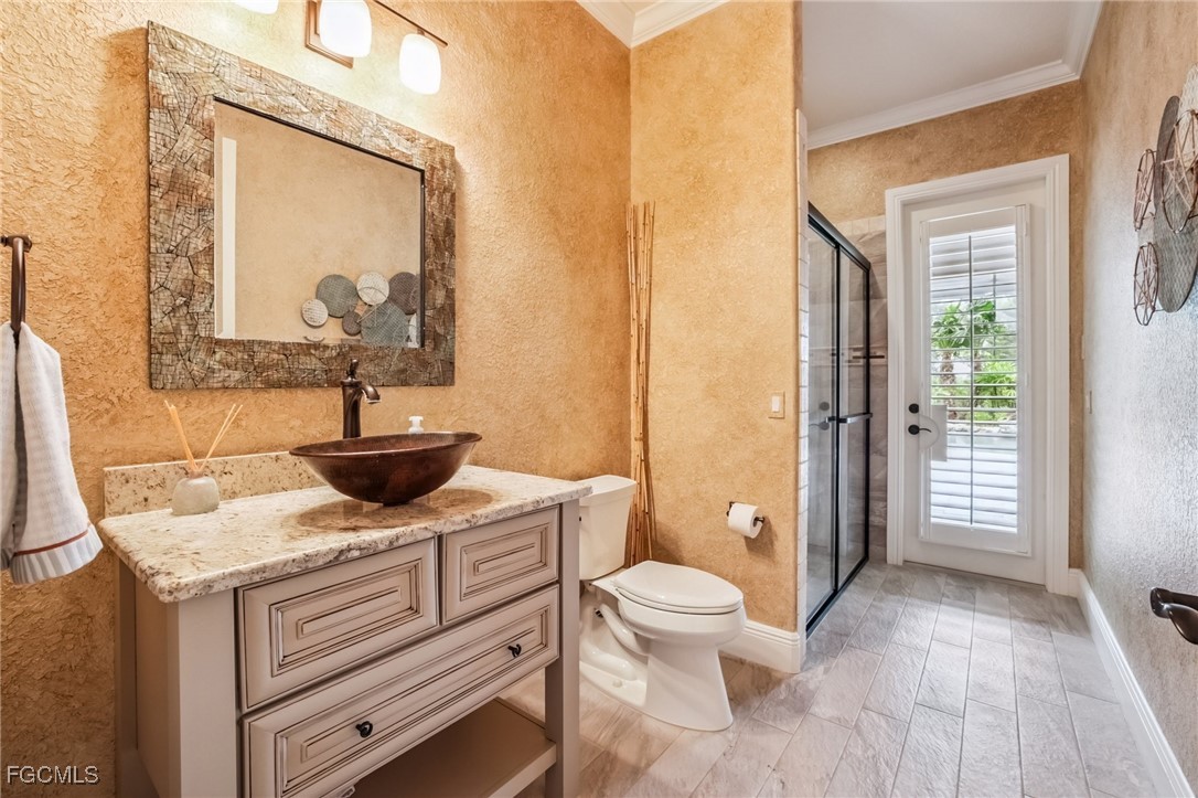 6041 Calusa Rdg Trail Bokeelia, FL 33922 - Photo 13 of 44 a view of bathroom with a toilet sink and tub