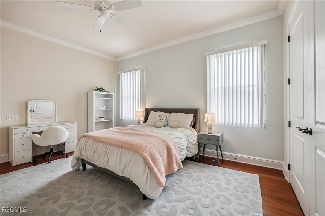 6041 Calusa Rdg Trail Bokeelia, FL 33922 - Photo 16 of 44 a bedroom with a bed and a window