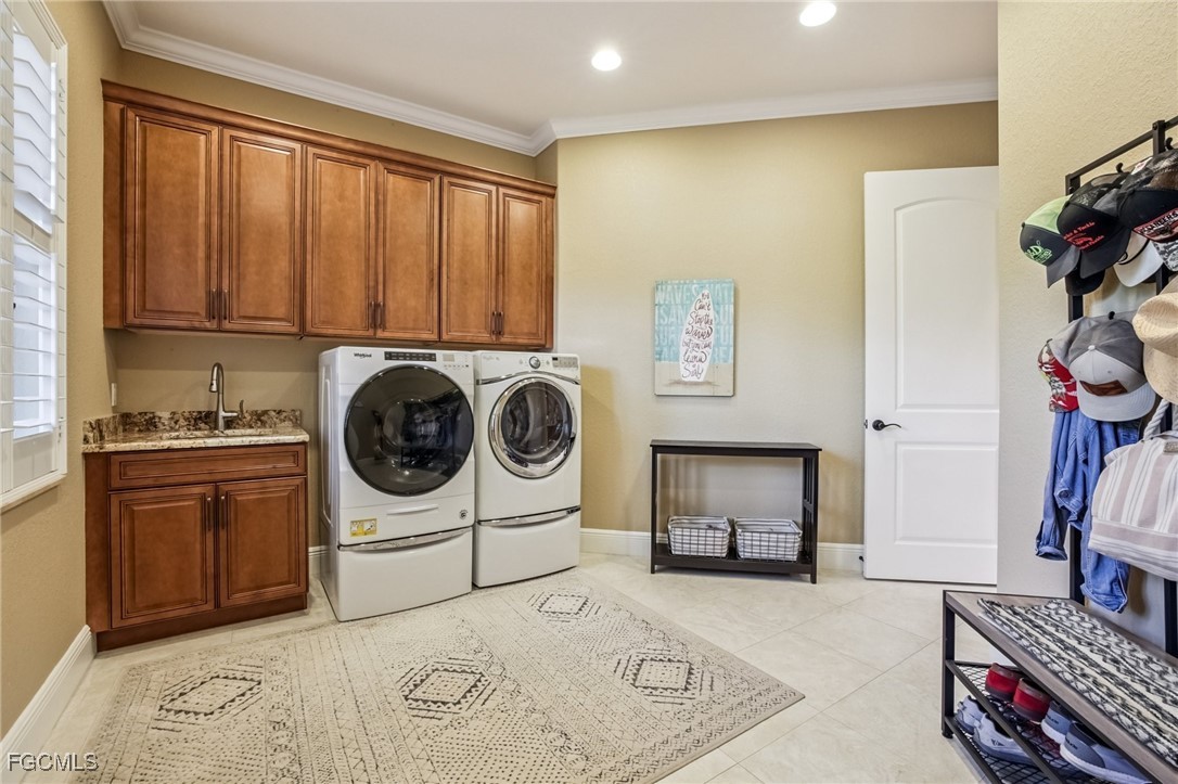 6041 Calusa Rdg Trail Bokeelia, FL 33922 - Photo 23 of 44 a utility room with sink dryer and washer