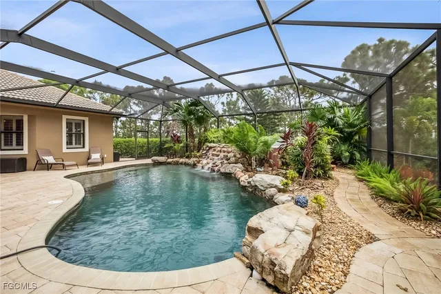 a view of a backyard with sitting area