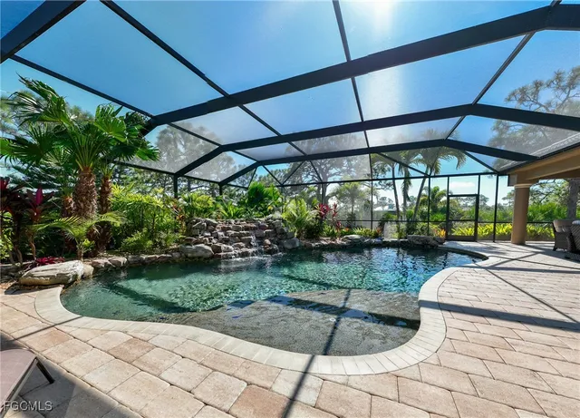 a view of a backyard with sitting area