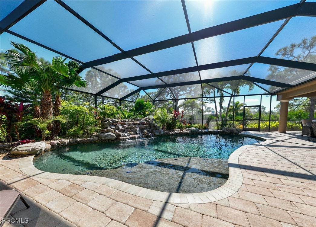 6041 Calusa Rdg Trail Bokeelia, FL 33922 - Photo 25 of 44 a view of a backyard with sitting area