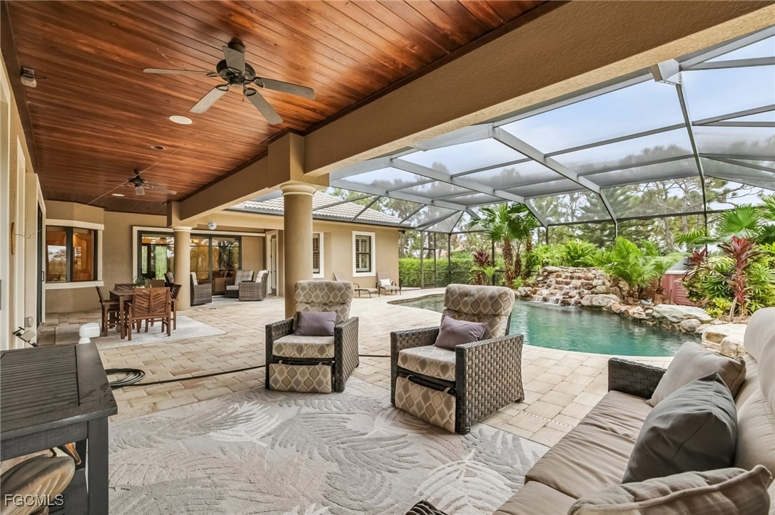 6041 Calusa Rdg Trail Bokeelia, FL 33922 - Photo 28 of 44 a outdoor living space with patio furniture and garden view